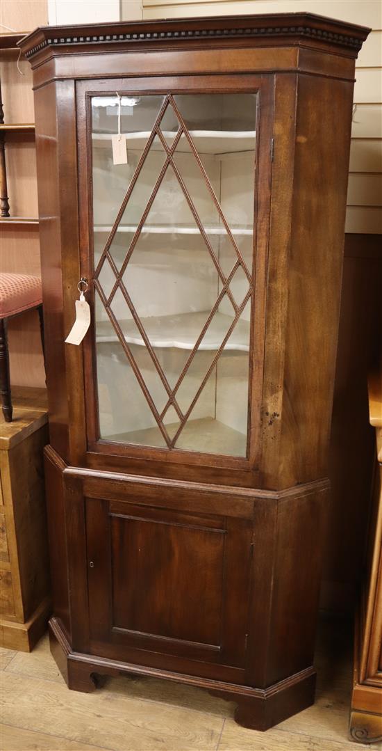 A George III style mahogany glazed standing corner cupboard H.189cm